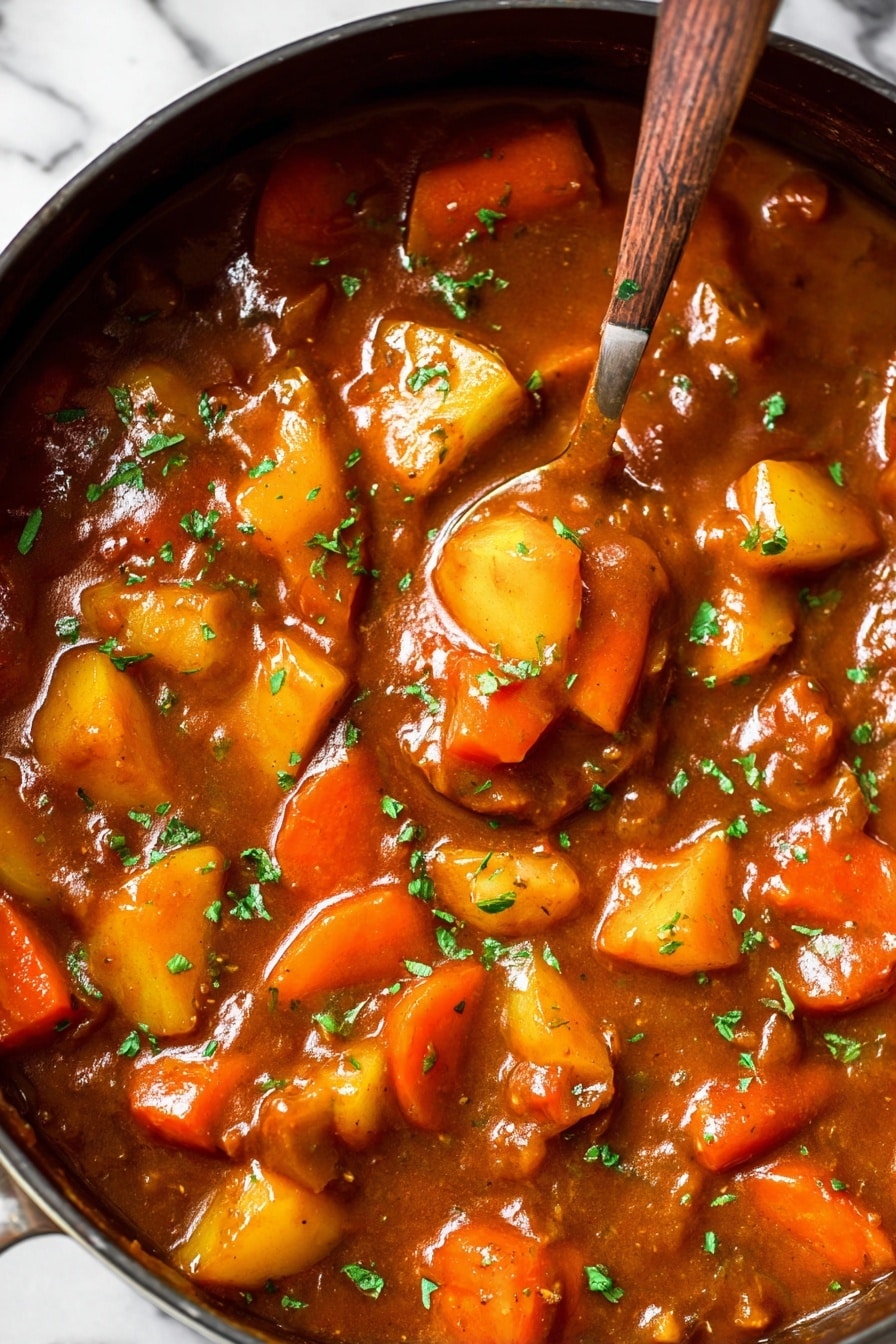 Vegan Irish Stew, vegan Irish stew recipe, hearty plant-based stew, vegan Irish stew with Guinness, vegan Irish stew ingredients - The image shows a thick stew in a large pan filled with chunky vegetables including bright orange carrot slices and yellow potato pieces. The stew sauce is rich brown and glossy, spread evenly around the vegetables. Small green herb pieces sprinkle the top, adding a fresh contrast to the warm tones. A spoon sinks into the stew, lifting some of the colorful vegetables, making the texture appear smooth and hearty. The background surface is a white marbled texture. photo taken with an iphone --ar 2:3 --v 7