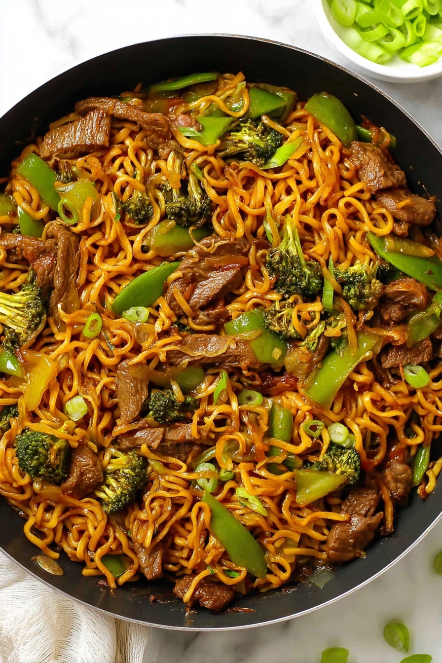 Sticky Beef & Noodles, one pan beef stir-fry, easy beef noodle recipe, quick weeknight dinner, flavorful beef and noodle dish - The image shows a black pan filled with stir-fried noodles layered evenly throughout, with an orange-brown sauce coating the spiraled noodles. On top and mixed in, there are medium-sized pieces of cooked beef with a browned texture, bright green bell pepper slices, and green broccoli florets. The noodles and vegetables are evenly spread, creating a colorful mix of orange, green, and brown in the pan. The pan is set on a white marbled surface with a small white bowl partially visible in the corner, holding sliced green onions. Photo taken with an iphone --ar 2:3 --v 7