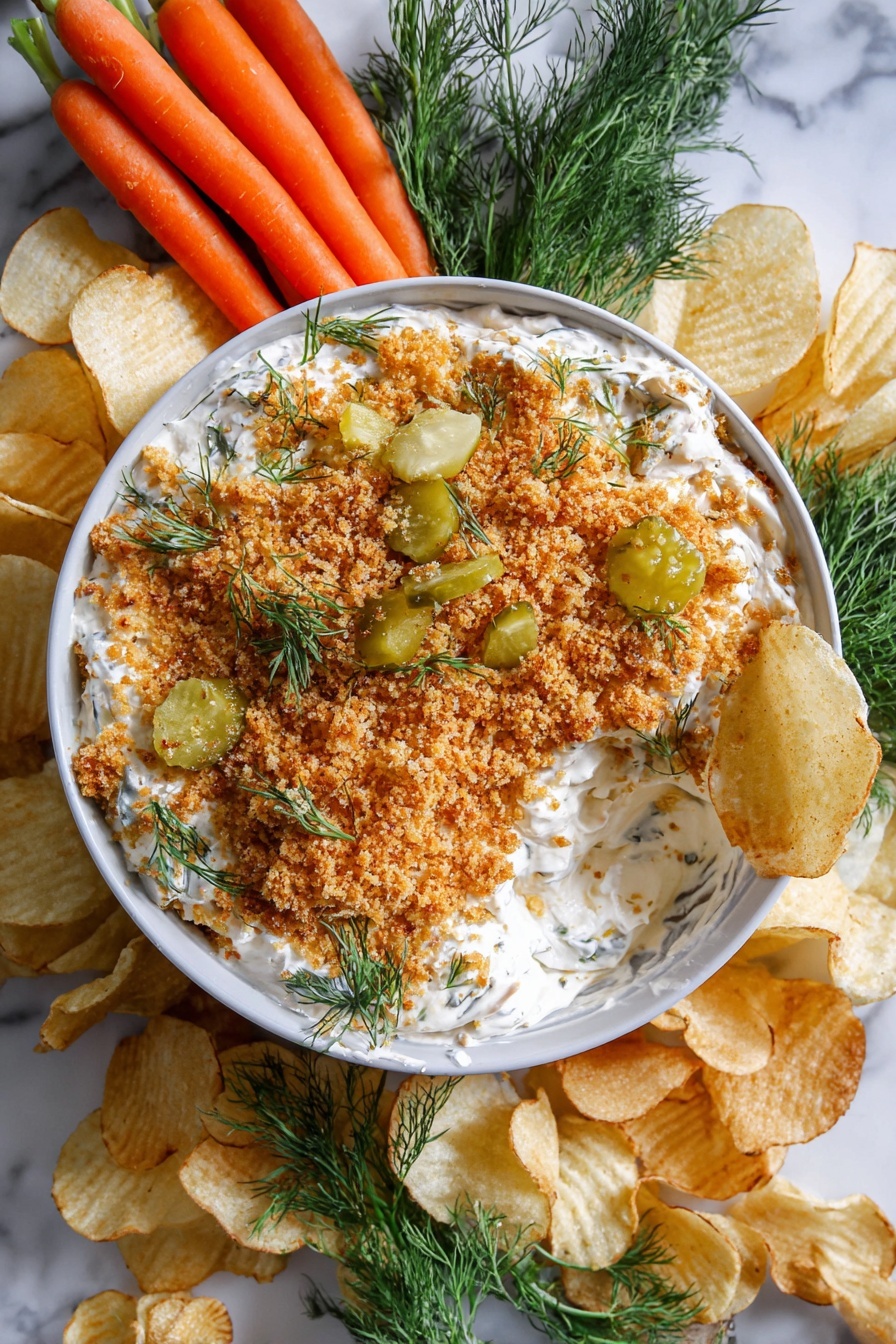 Creamy Pickle Dip with Toasted Panko, tangy pickle dip, crunchy appetizer dip, easy party dip, homemade pickle dip - A white bowl filled with a creamy white dip topped with a thick layer of golden brown crumbs, scattered pickles, and sprigs of fresh green dill. The dip has scoops taken out, revealing the creamy texture beneath the crumb topping. Around the bowl, there are light golden crinkled potato chips placed on a white marbled surface, along with a small bunch of bright orange baby carrots on one side and fresh green dill sprigs on another side. The whole arrangement sits on a white marbled texture. photo taken with an iphone --ar 2:3 --v 7