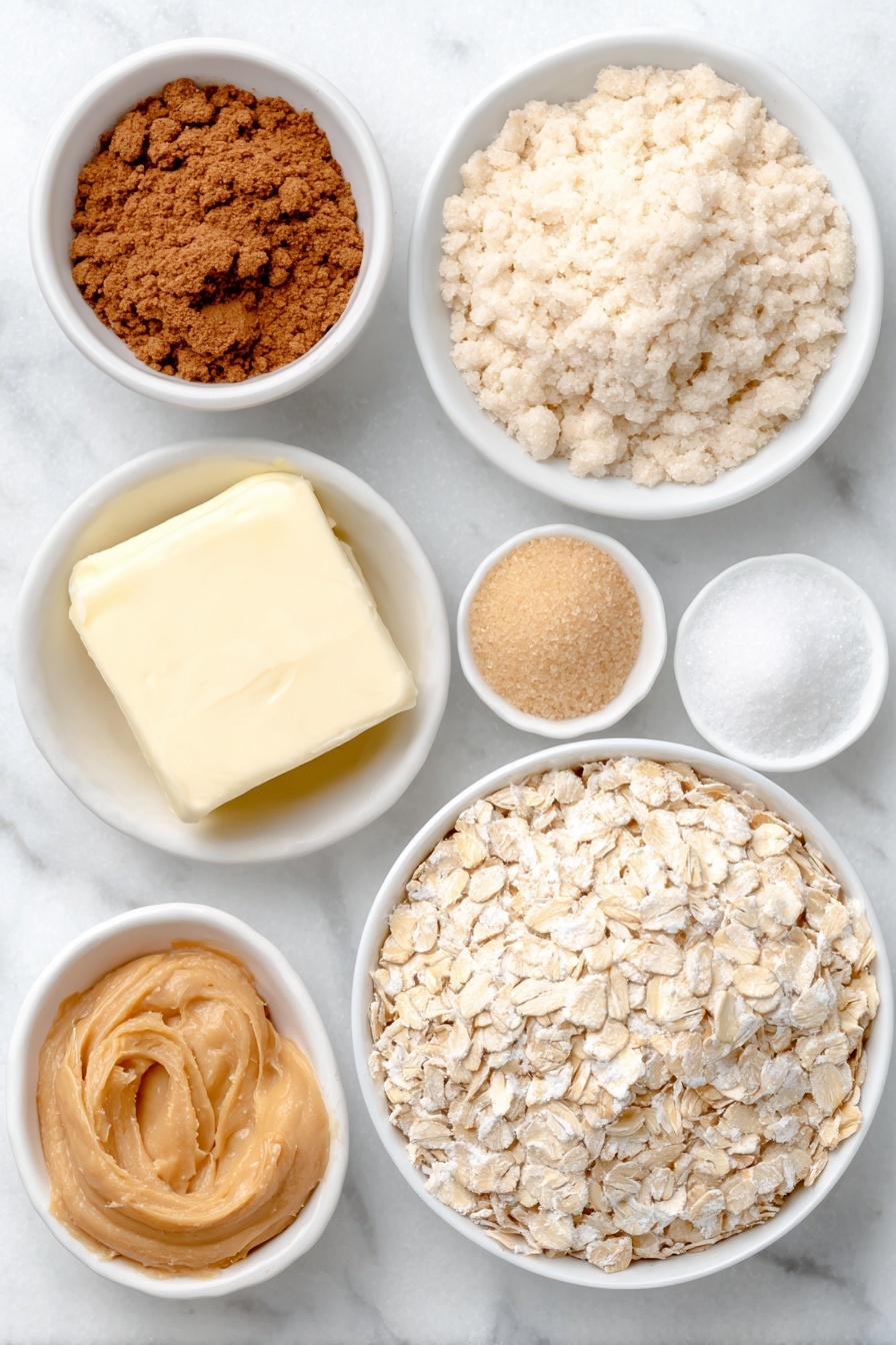Peanut Butter Oatmeal Cookies, chewy oatmeal cookies with peanut butter, easy peanut butter cookies, cinnamon oatmeal cookies, homemade peanut butter treats - Flat lay of old fashioned oats loosely piled, a small mound of all-purpose flour, a few grains of light brown sugar in a small white ceramic bowl, a few granules of white granulated sugar in a small white ceramic bowl, a small pinch of kosher salt, a tiny heap of ground cinnamon, a few tablespoons of softened unsalted butter in a simple white ceramic bowl, creamy peanut butter dolloped in a white ceramic bowl, one large whole egg with clean shell, and a small white ceramic bowl holding clear vanilla extract placed on a clean white marble surface, soft natural light, photo taken with an iPhone, professional food photography style, fresh ingredients, white ceramic bowls, no bottles, no duplicates, no utensils, no packaging --ar 2:3 --v 7 --p m7354615311229779997