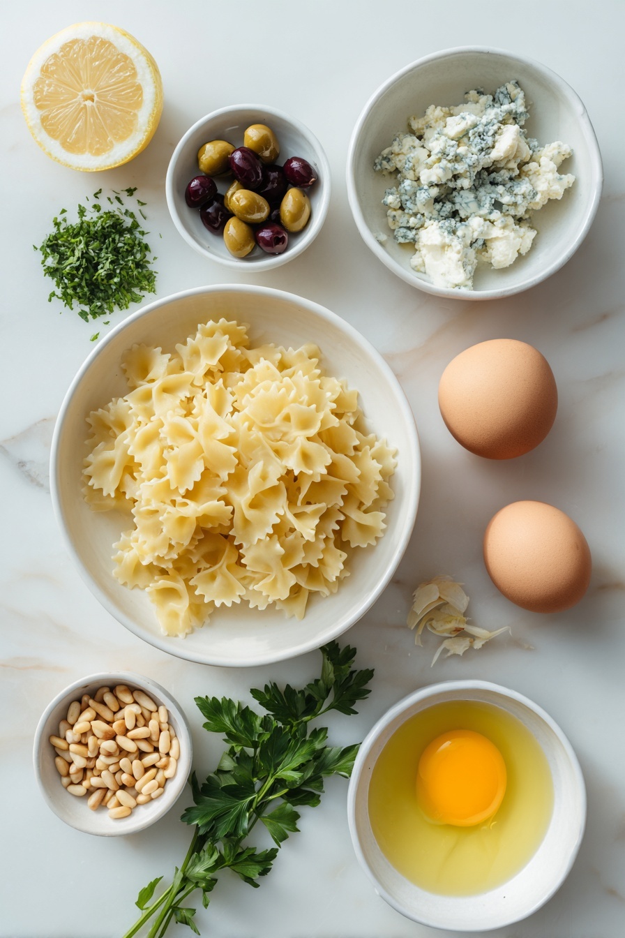 Dirty Martini Pasta Salad, pasta salad with olives and lemon, savory pasta salad recipe, summer pasta salad ideas, bold flavored pasta salad - Flat lay of a simple white ceramic bowl filled with a small pile of uncooked malfa corta pasta, a few sprigs of roughly chopped fresh parsley next to it, a small white bowl with a heap of smashed Castelvetrano olives, another small white bowl containing clear olive brine, crumbled blue cheese arranged in a small pile, toasted pine nuts scattered neatly in a small white bowl, a whole fresh lemon with visible zest shavings beside it, a small white bowl with freshly squeezed lemon juice, and a small white bowl holding minced garlic, alongside two whole uncracked brown eggs placed symmetrically, all ingredients fresh and natural, balanced perfectly in a professional flat lay composition placed on a clean white marble surface, soft natural light, photo taken with an iPhone, professional food photography style, fresh ingredients, white ceramic bowls, no bottles, no duplicates, no utensils, no packaging --ar 2:3 --v 7 --p m7354615311229779997