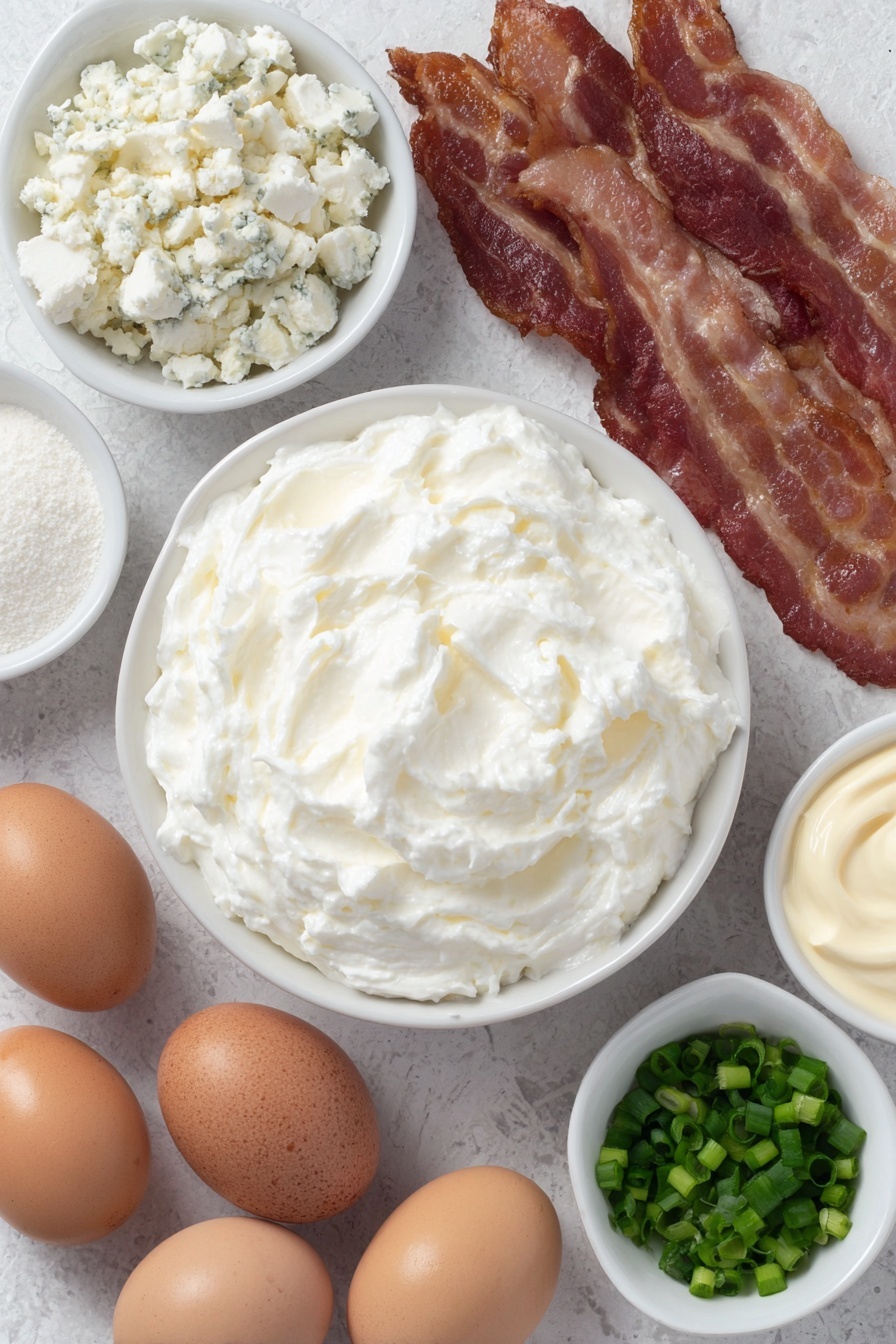 Baked Bacon Blue Cheese Dip, blue cheese dip, bacon dip, cheesy bacon appetizer, savory party dip - Flat lay of softened cream cheese in a small white ceramic bowl, a small white bowl filled with creamy mayonnaise, a small white bowl with crumbled blue cheese, a few whole uncracked brown eggs, several crispy cooked bacon slices without packaging, a small white bowl of garlic powder, and a small white bowl of freshly chopped green onions placed in perfect symmetry, all ingredients fresh and natural, no duplicates, no utensils, no packaging, no bottles --ar 2:3 --v 7 --p m7354615311229779997