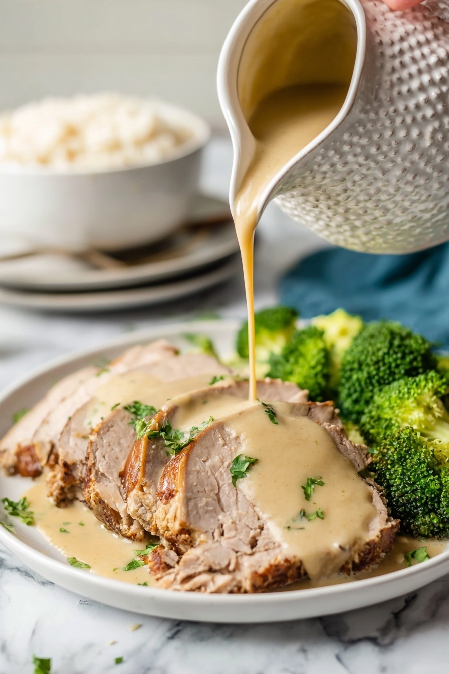Crock Pot Pork Roast with Gravy, slow cooker pork recipes, easy pork dinner ideas, tender pork roast recipe, savory gravy recipes - A white plate holds several slices of light brown cooked meat with a slightly darker crust on the edges, arranged in a neat row. A woman's hand pours a thick, creamy beige sauce over the center slices, creating a smooth layer that drapes over the meat. Bright green parsley pieces are scattered on top, adding color contrast. On the side of the plate, vibrant green broccoli florets add freshness to the dish. The scene is set on a white marbled surface, and in the background, a white textured pitcher is seen pouring the sauce, with a white bowl filled with rice and a stack of white plates slightly blurred. photo taken with an iphone --ar 2:3 --v 7