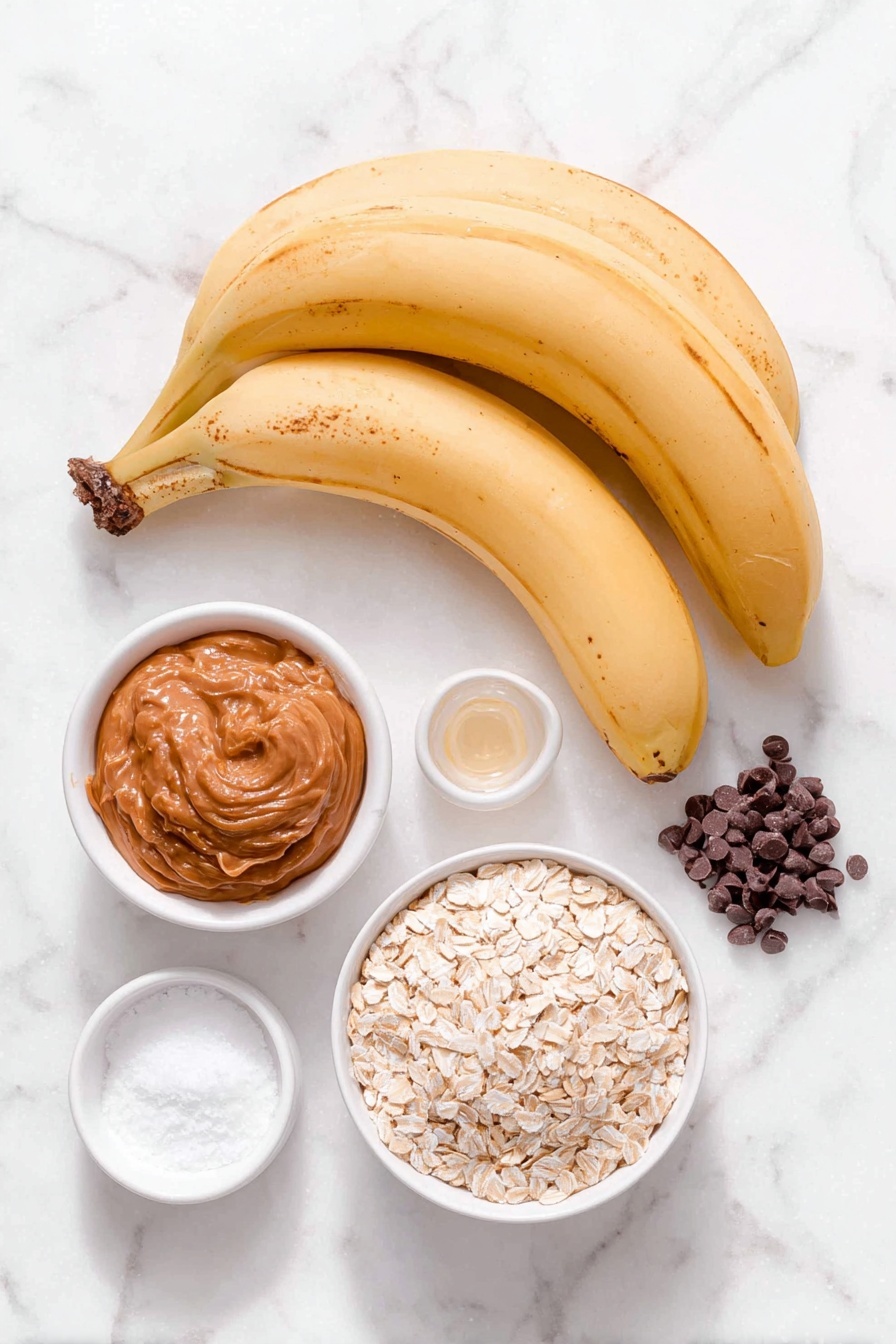 Peanut Butter Banana Bars, healthy banana snack bars, easy banana bars recipe, quick no-bake snack, wholesome banana treats - Flat lay of three very ripe bananas with soft spots on their bright yellow peel, a small white ceramic bowl filled with smooth natural peanut butter, a small white ceramic bowl containing golden quick-cooking oats, a few shiny dark chocolate chips scattered beside a small white bowl holding additional chocolate chips, a tiny white bowl with pure vanilla extract, a small heap of fine white salt, and a pinch of baking powder placed neatly, all arranged symmetrically and balanced on a clean white marble surface, soft natural light, photo taken with an iPhone, professional food photography style, fresh ingredients, white ceramic bowls, no bottles, no duplicates, no utensils, no packaging --ar 2:3 --v 7 --p m7354615311229779997