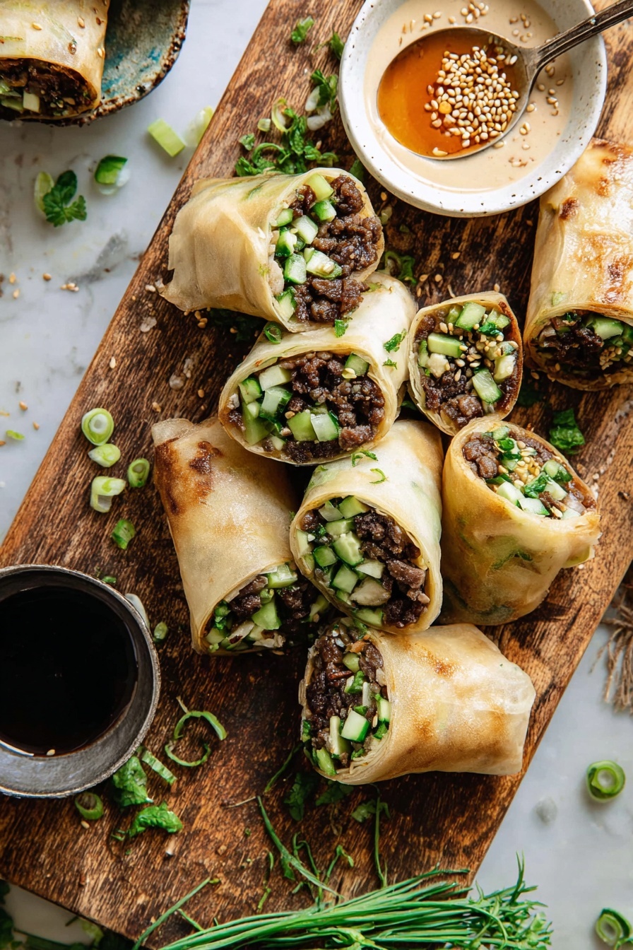 Thai Basil Beef Wraps, Thai Basil Beef Wraps recipe, flavorful Thai beef wraps, quick Thai beef wraps, Asian beef wraps - The image shows several rolls with light golden, slightly translucent wraps filled with dark brown cooked meat, small diced green cucumbers, leafy herbs, and light-colored crushed nuts inside. Some rolls are whole and others are cut in half to show the filling layers clearly. The rolls are placed on a wooden board with a small white bowl containing a light brown sauce sprinkled with sesame seeds near the top right. A small spoon with some sauce rests near the bowl, and another small metal cup with dark soy-like sauce sits on the bottom left. Fresh green herb sprigs and thin slices of green onion are scattered on and around the rolls. The background is a white marbled texture. photo taken with an iphone --ar 2:3 --v 7